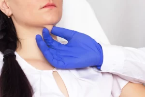a hand examines the woman's double chin